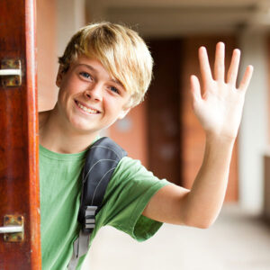 boy waving